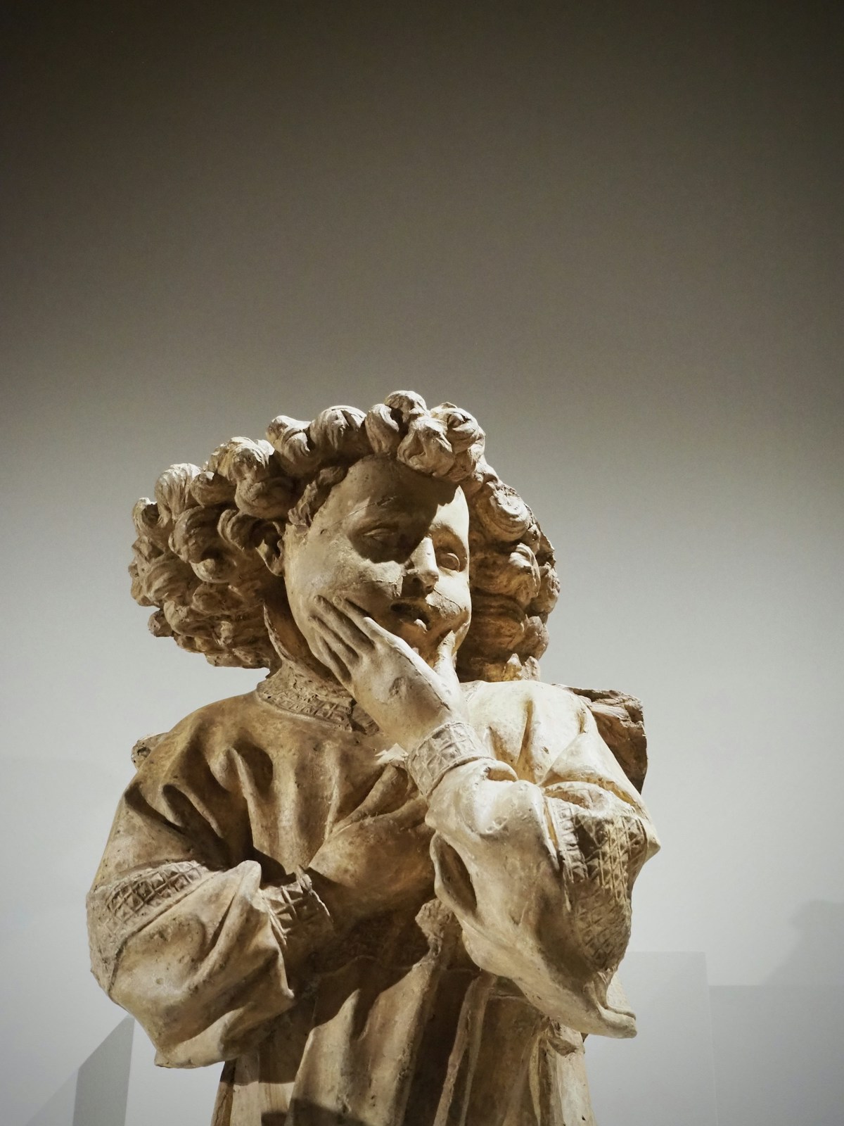 Contemplative Figure Stone Carving